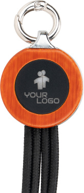 Logotrade Firmengeschenke das Foto: 4-in-1-Kabel mit elighted-Logo im Holzgehäuse